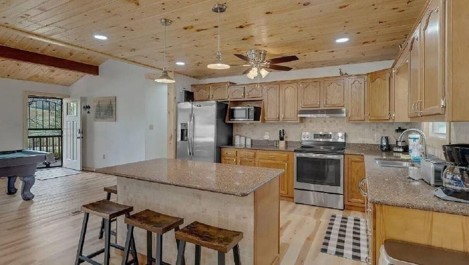 Kitchen view and 4 bar stools