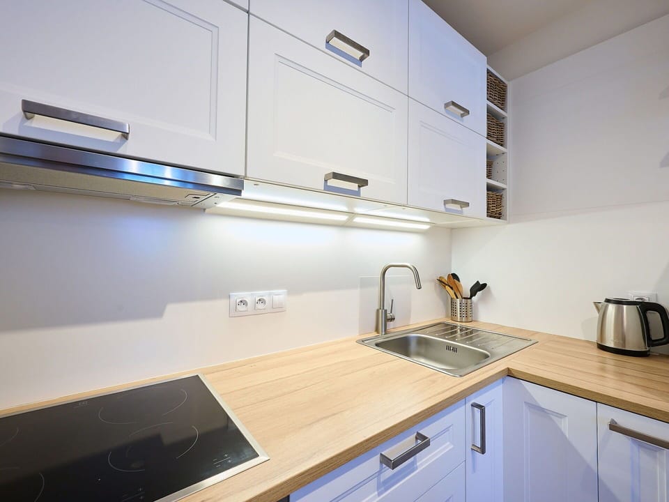 Kitchen, Countertop, Kitchen Appliance, Wood, Interior Design, Major Appliance, Cabinetry, Flooring, Light Fixture, Lighting