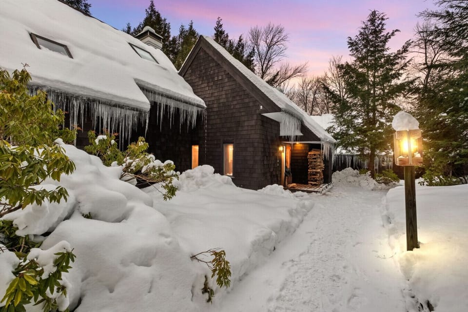 Cozy up to this charming chalet nestled in the snow.