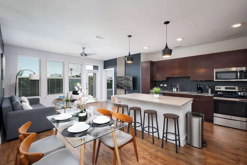Experience Effortless Flow in this Open-Concept Living, Kitchen, and Dining Area