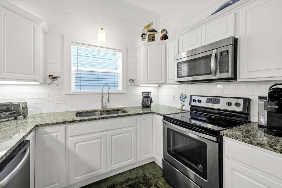 Your fully equipped kitchen features granite counters, stainless appliances, and everything you need to prepare memorable meals during your stay.