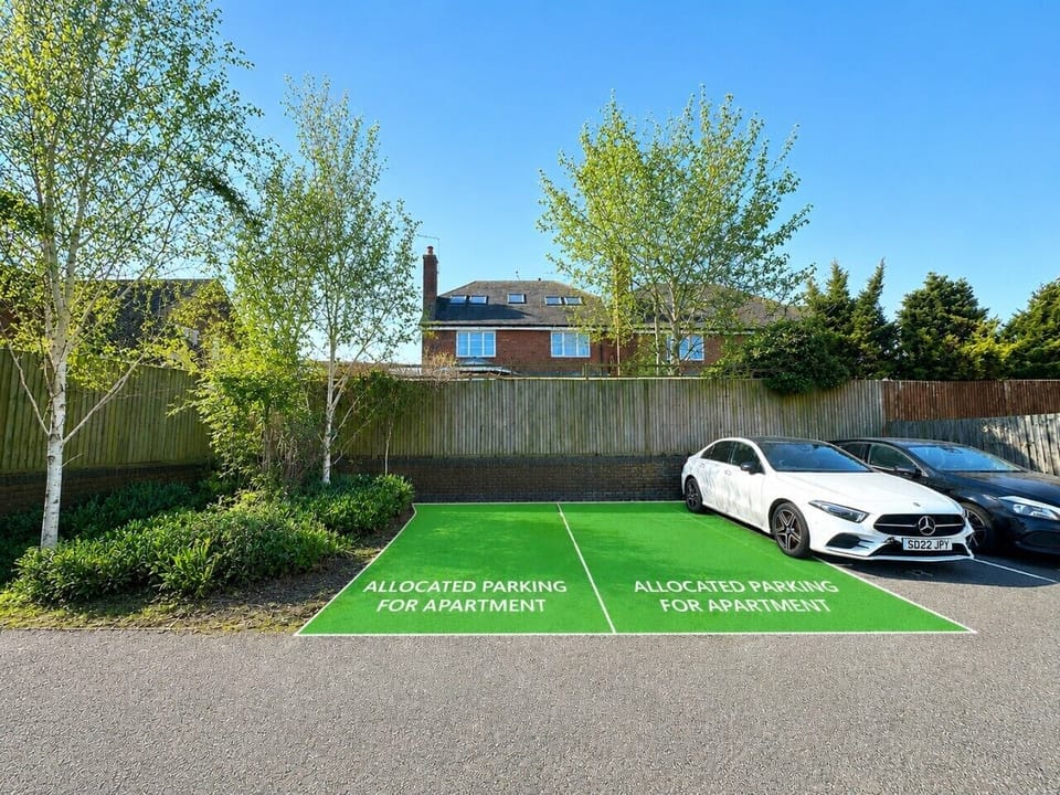 Two allocated parking spaces at the back of the apartment block.