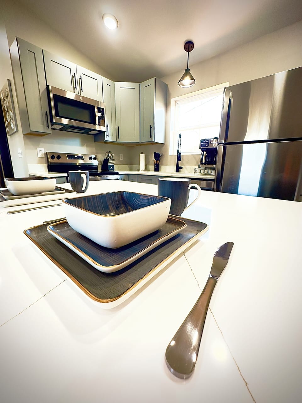 Fully equipped modern kitchen with sleek appliances, ample counter space.
