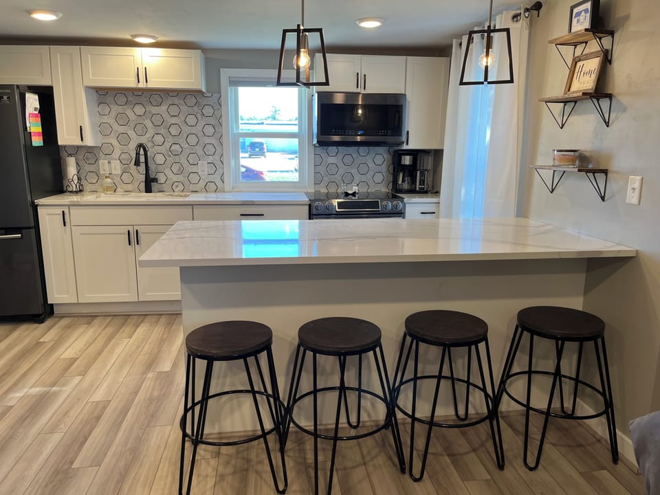 Bright kitchen area with appliances 