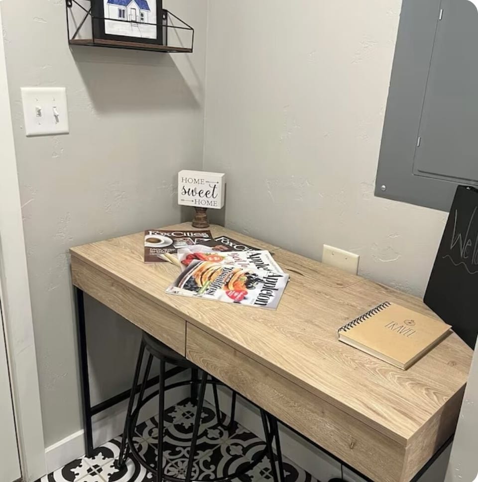 Desk in entry way. Welcome binder and local reading. 