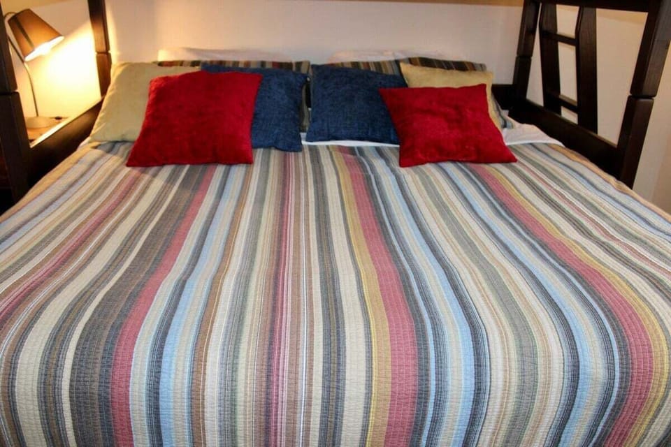 This close-up shows the lower bed beneath the upper bunk.