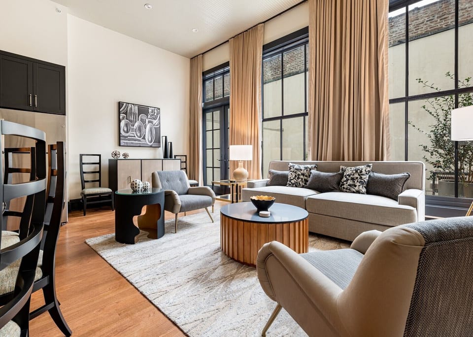 Ideal for group gatherings, this unit combines indoor luxury with a spacious private patio. High ceilings and large windows ensure a light-filled environment.