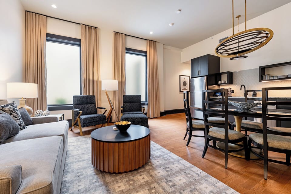 Living room 1 - Stylish connecting units with a private patio and large windows on iconic Canal Street.