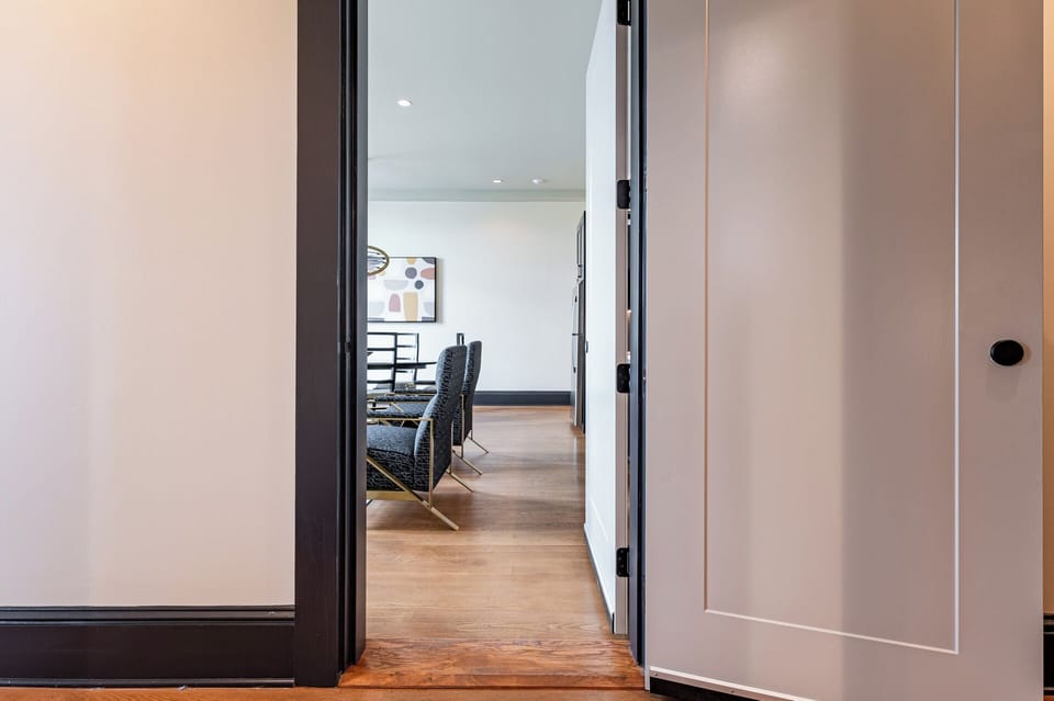 Open connection to a second unit featuring another full kitchen, living area, and additional bedrooms, providing ideal space for group stays or family gatherings.