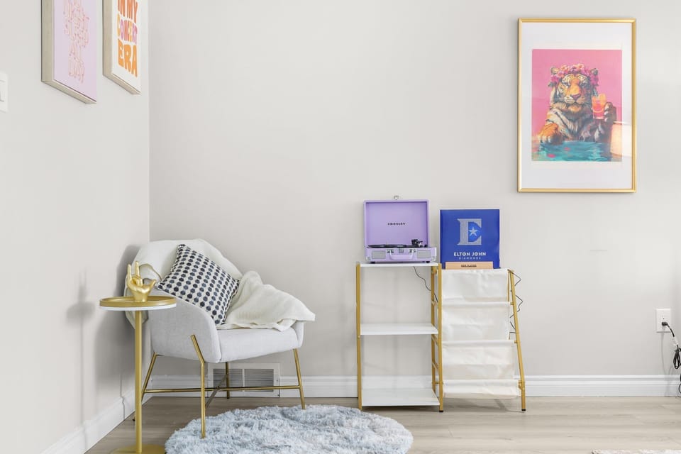 Charming reading nook with a comfy chair, soft rug, and stylish décor.
