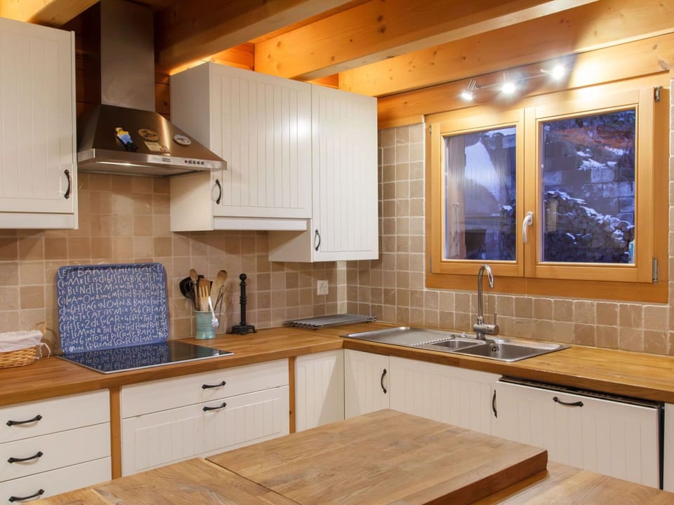 Kitchen, Countertop, Cabinetry, Kitchen Appliance, Furniture, Flooring, Interior Design, Wood, Major Appliance, Kitchen Sink