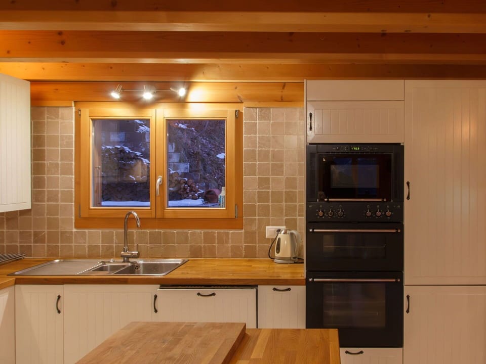 Kitchen, Countertop, Kitchen Appliance, Flooring, Furniture, Cabinetry, Interior Design, Major Appliance, Wood, Floor