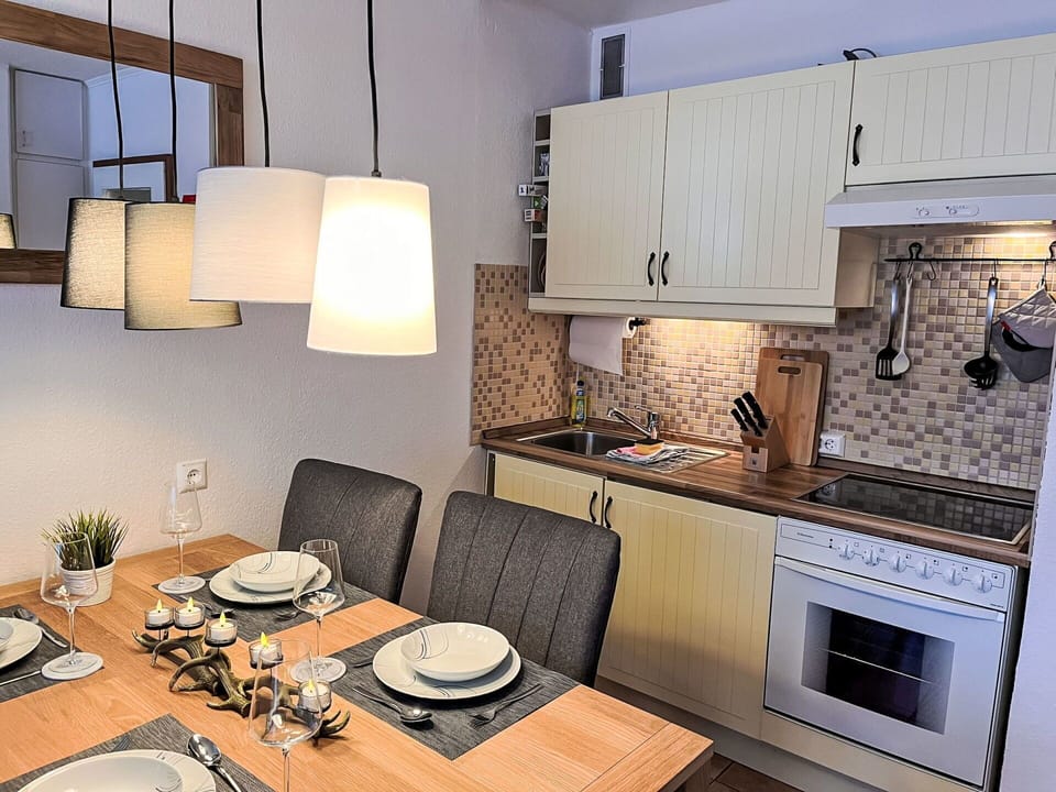 Furniture, Interior Design, Flooring, Wood, Kitchen, Major Appliance, Kitchen Appliance, Countertop, Room, Floor