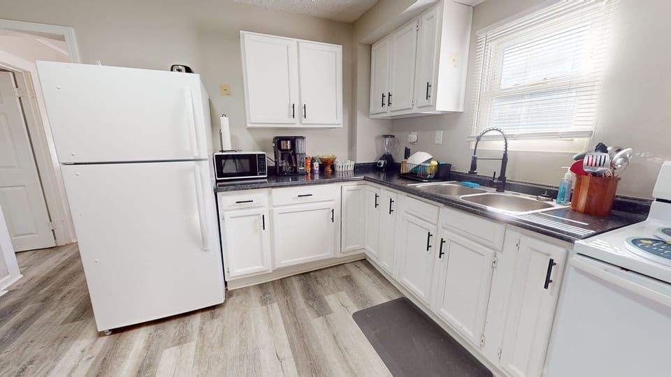 - Fully stocked kitchen
- Coffee bar w/ drip coffee machine
- Tea kettle