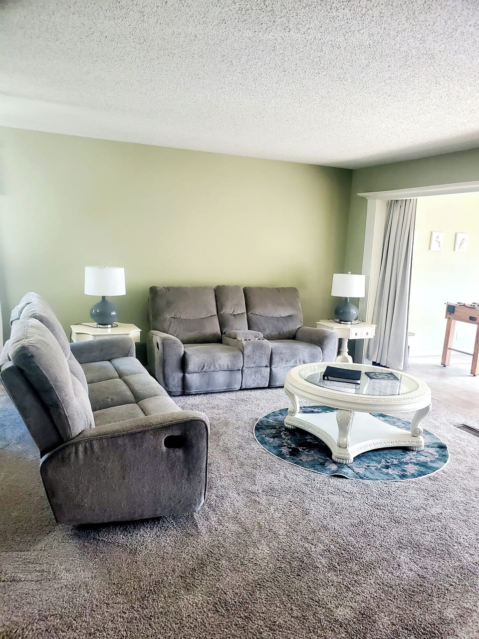 Living room. Both couches have recliners on each end