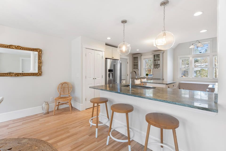 The kitchen bar provides a modern spot for casual dining and morning coffee
