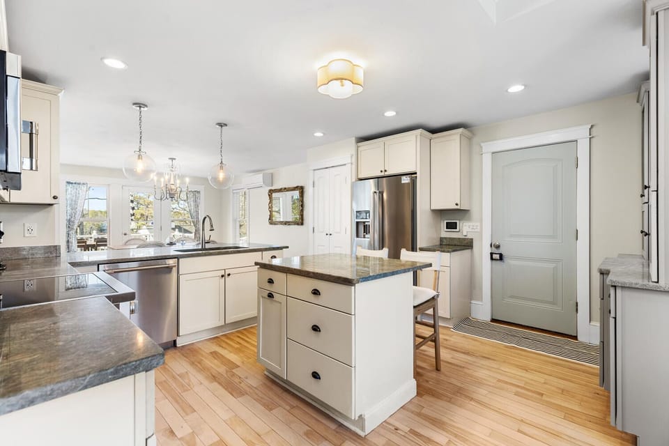 The spacious center island offers ample counter space for meal prep and dining