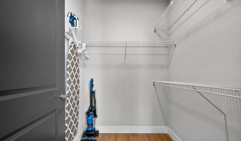 Master Closet Offers Plenty of Storage and a Full Size Ironing Board and Iron. Spill Something? Use the Vacuum to Make the Clean-Up Simple. 
