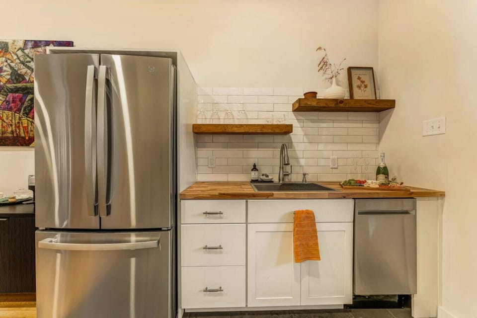 A sleek, modern fridge perfect for storing your essentials during your stay.