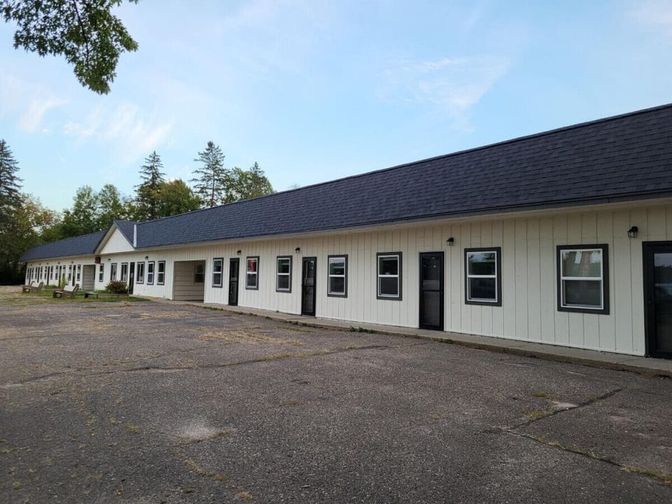Boutique building offering paved parking and a neutral facade.