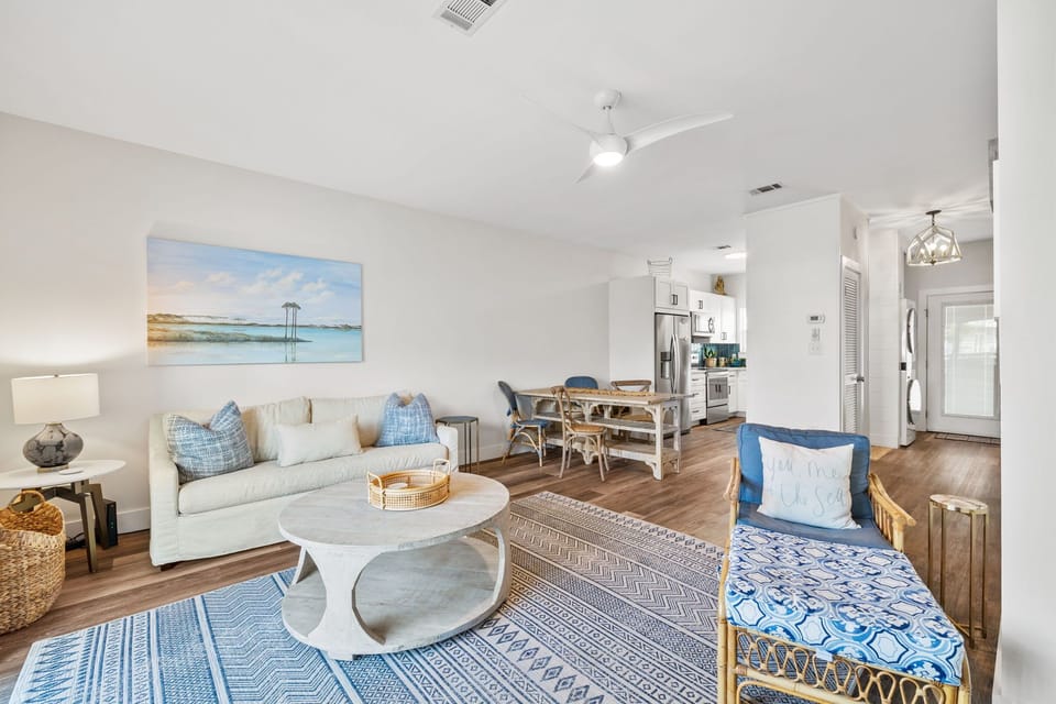 Living room with sleeper sofa, smart TV and balcony with dining table