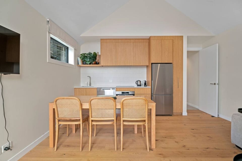 Open plan kitchen and dining area where you can prepare and enjoy meals.