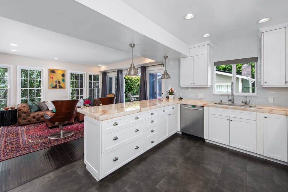 Standing in the kitchen with view of the tv room
