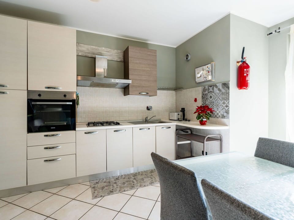 Kitchen, Kitchen Appliance, Countertop, Furniture, Major Appliance, Flooring, Cabinetry, Interior Design, Wood, Floor