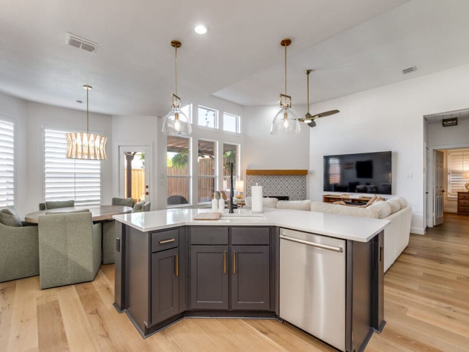 Open kitchen with views of the pool and hot tub