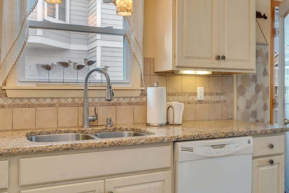 The spacious kitchen offers plenty of room to prepare meals during your stay.