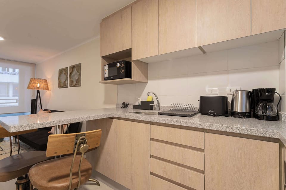 Stylish kitchen with modern appliances and cozy dining area, ideal for culinary adventures and relaxation.