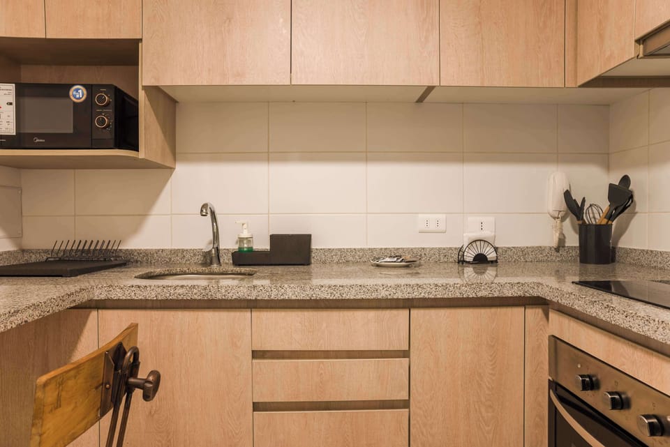 Cozy and efficient kitchen with modern amenities, perfect for preparing meals during your stay.