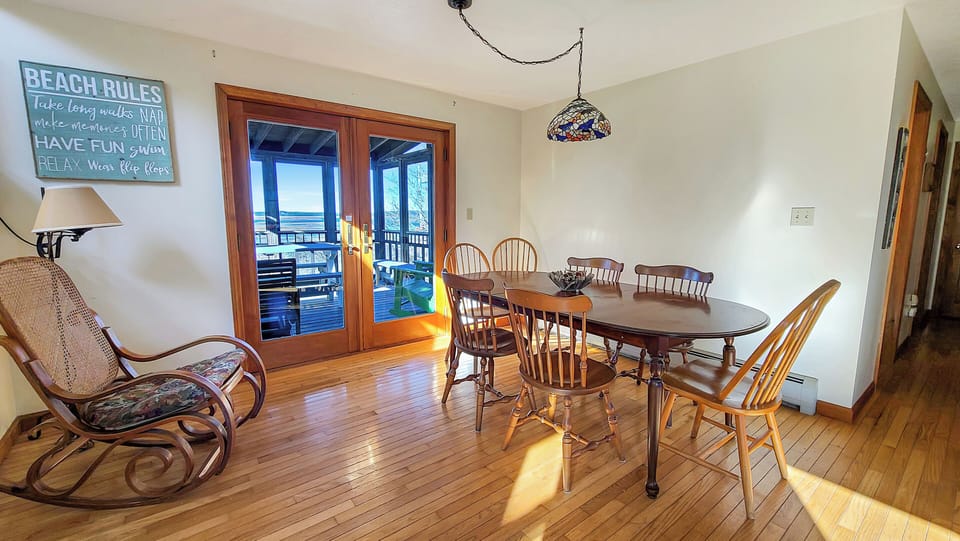 Dining area with French doors to screened-in porch