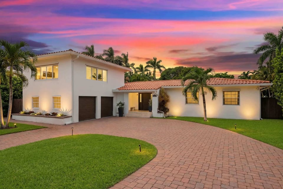 Stunning curb appeal with vibrant sunset views and lush greenery awaits your arrival!