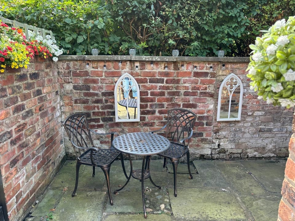 Take a moment to enjoy the fresh air in this serene garden