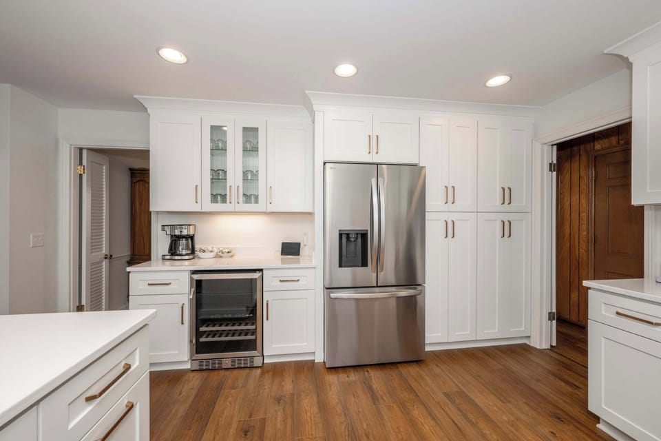 The sophisticated kitchen offers ample space & every home comfort
