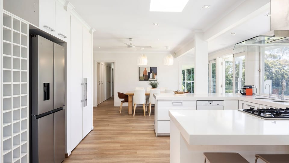 Kitchen with basic appliances and a fridge 