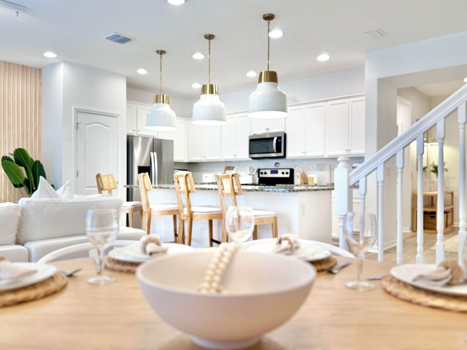 Open concept combining the living room, kitchen, and dining areas.