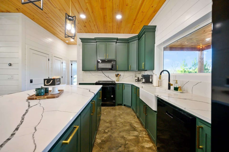 The chic, open kitchen offers ample space & all the comforts of home