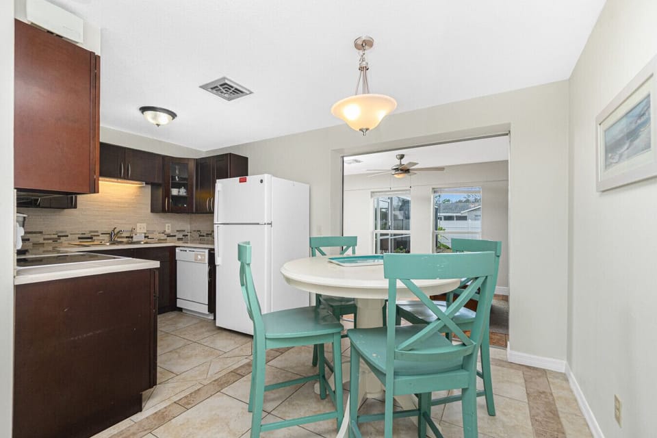 kitchen and dining area with round table at Englewood Florida vacation rental home