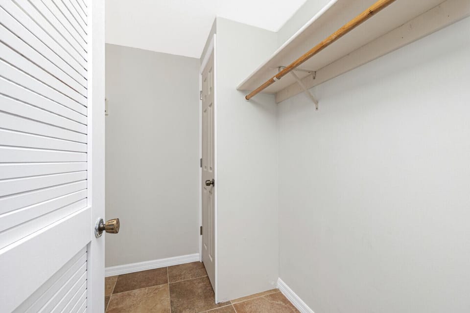 walk in closet in primary bedroom at Englewood Florida vacation rental home