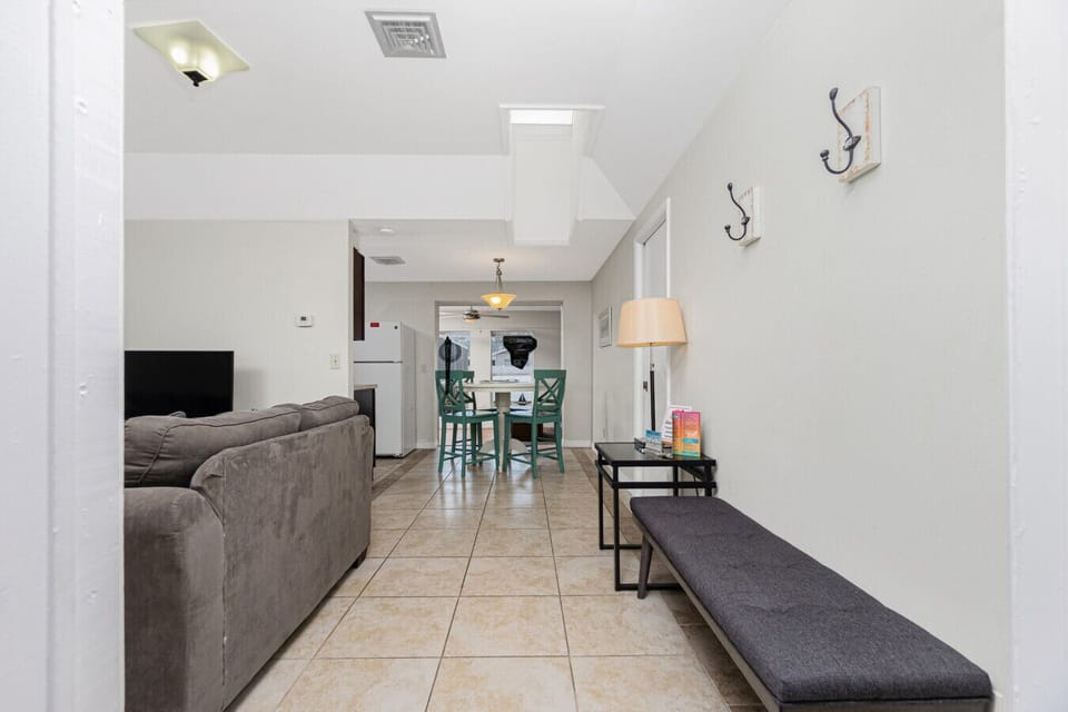 open living room and dining area with seating at Englewood Florida vacation rental home