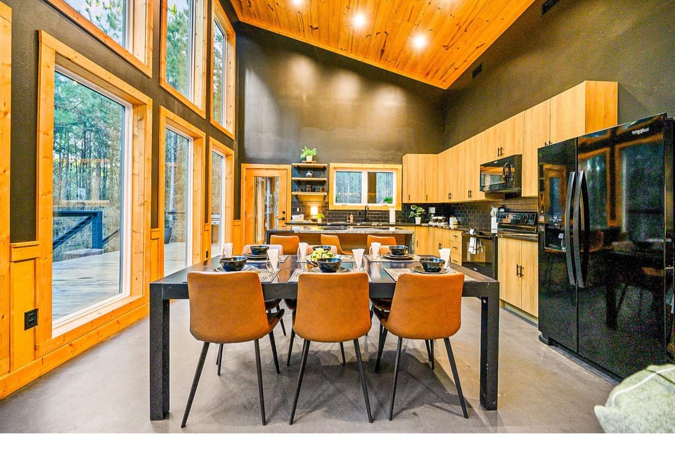 Savor meals in style with panoramic windows and chic, modern furnishings!