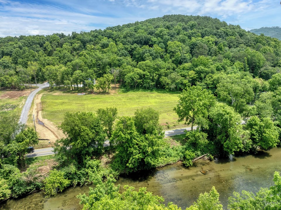 Driveway area and walking path to the river for fishing, kayaking and tubing. 