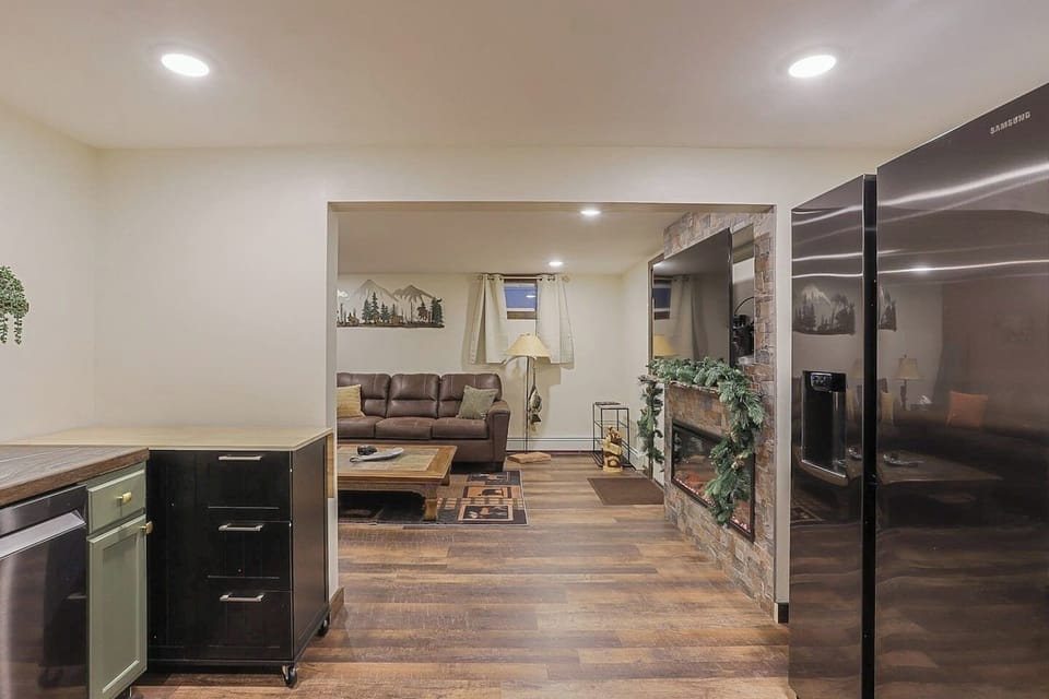 Living Room:  - 2 Large couches and plenty of seating  - Custom Metal art - 55" Roku Smart Tv - Cable - Streaming capabilities - Room darkening curtains - Custom fish standing lamp - Custom wood bear - Bear costars - Metal fish coffee table decor