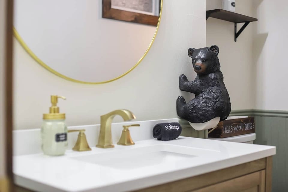 - Premium linens  - Makeup towels - Cotton pads - Cotton swaps - Lotion  - Unique Bear toilet paper holder with extra TP in basket - Gold round mirror  - Illuminating vanity lights - Hand soap - Beautiful wheat flower frosted window