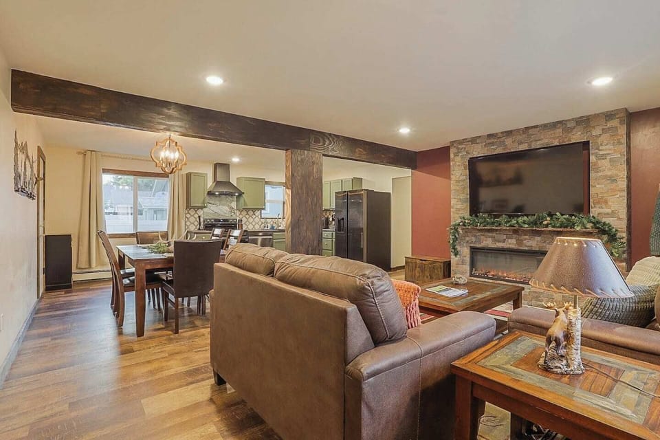 Living room, Dinning room, Kitchen: - Electric fireplace - 2 couches - 65" Roku smart TV - Electric oven - Full sized fridge/freezer  - Custom live edge mantle - Unique and custom decor