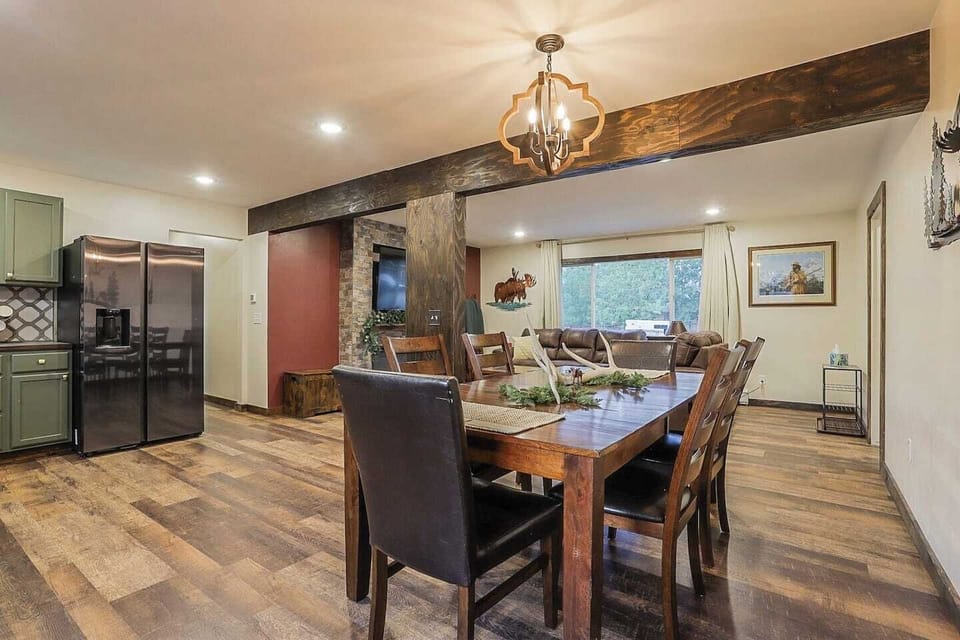 - Large dining table, seating for 6  -Salt and pepper shakers - Place matts  - Decor: real elk antler - Pull out trash bin - Wood chandelier - Room darkening curtains - Spacious living room - Custom wood beams