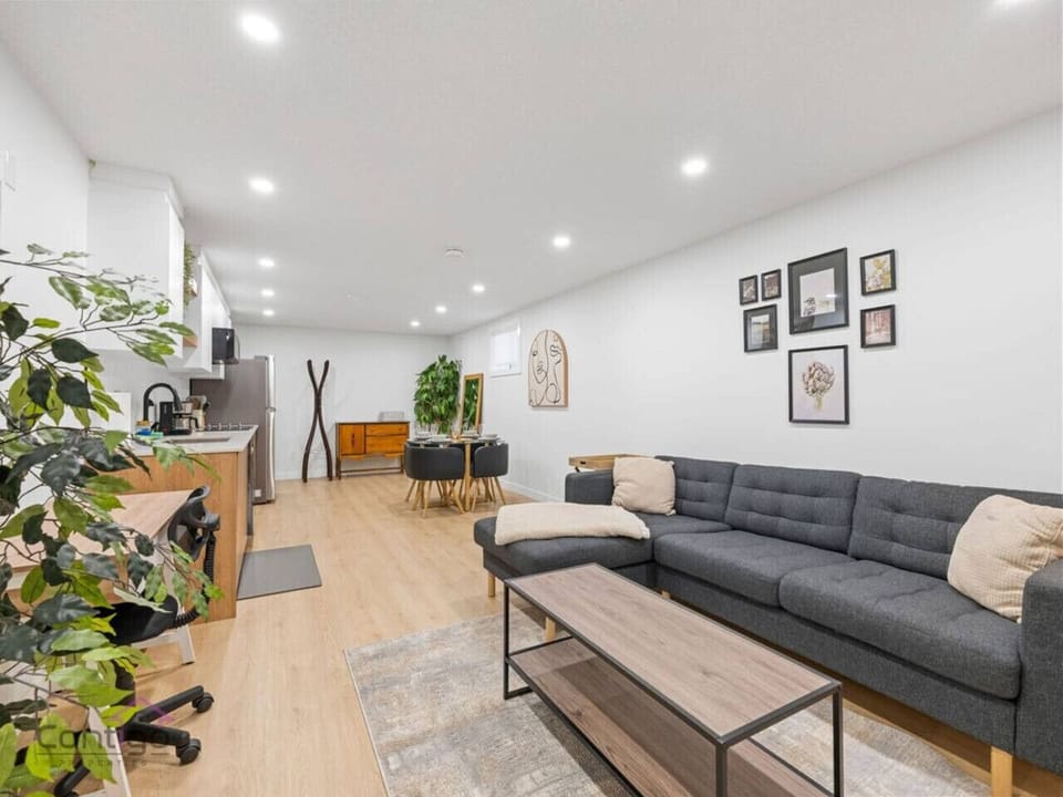 A comfy sofa sleeps one, while not a sofa bed—great for groups or families with kids!
