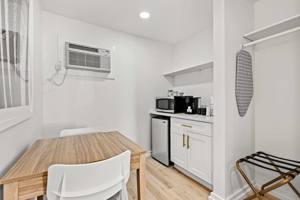 Laptop friendly work space, microwave, coffee maker, mini fridge, and closet space!